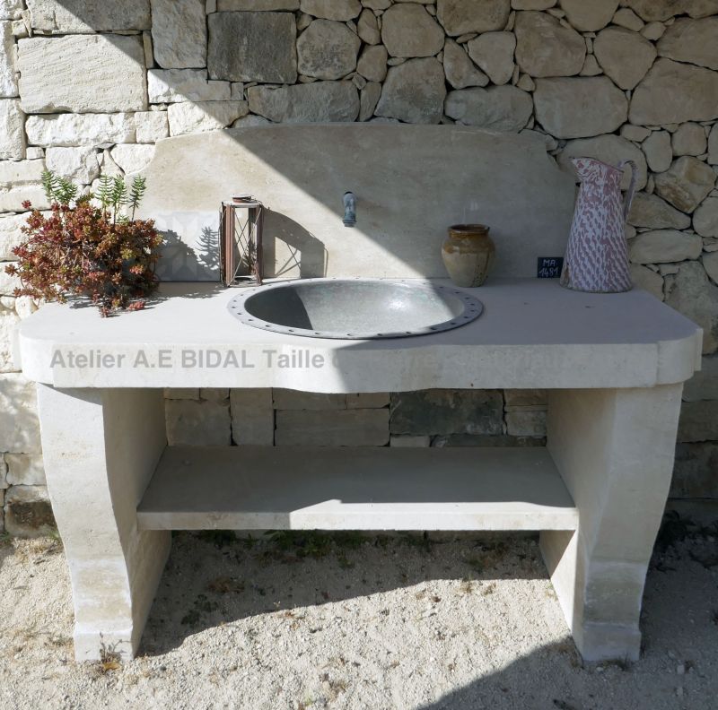Beautiful practical and solid stone sink for a charming summer kitchen.