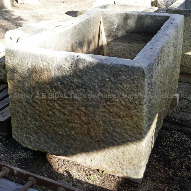 Old massive stone trough for sale at the Antique Materials in Provence Alain Bidal.