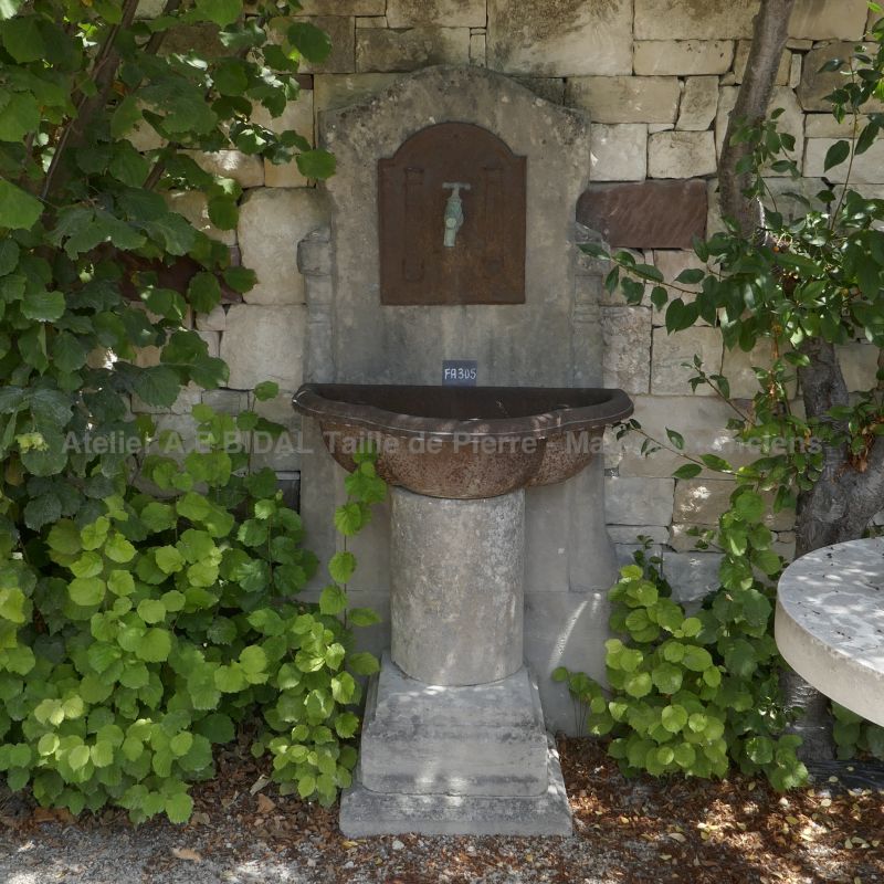 Wall fountain made of reclaimed materials | Old garden fountain made of vintage elements.