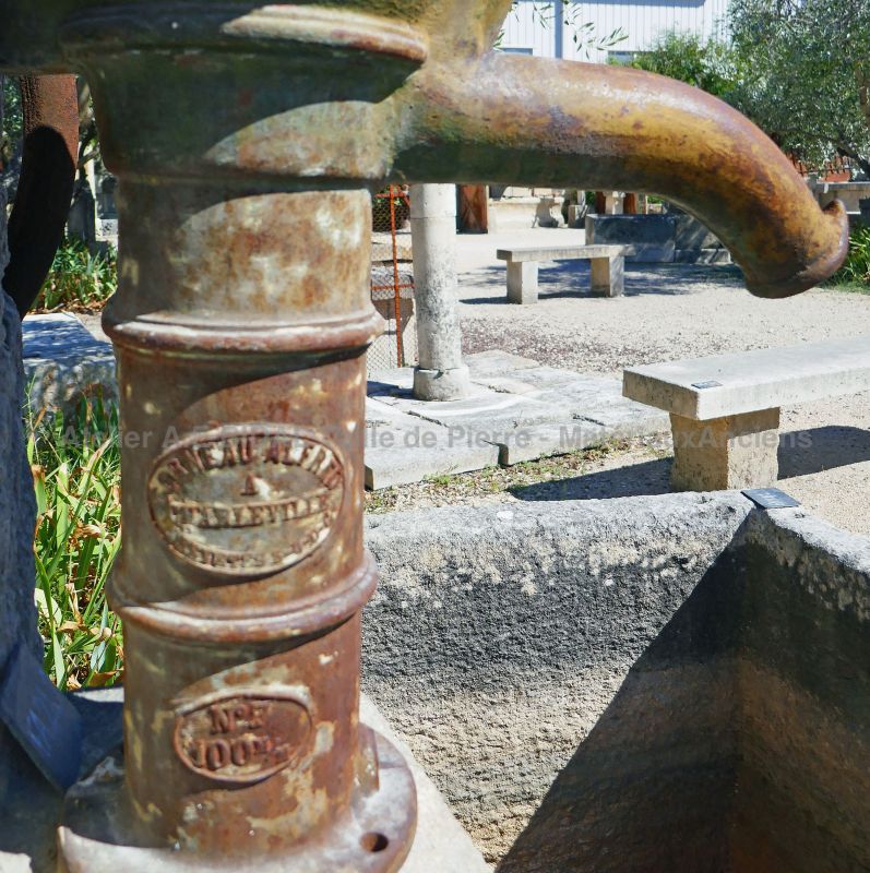 Detail of the old cast iron manual pump on our garden fountain.