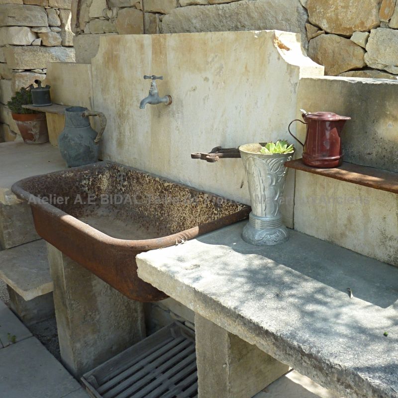 Summer kitchen with sink on jambs and pediment in stone | Antique garden furniture on sale at Alain Bidal in Provence.