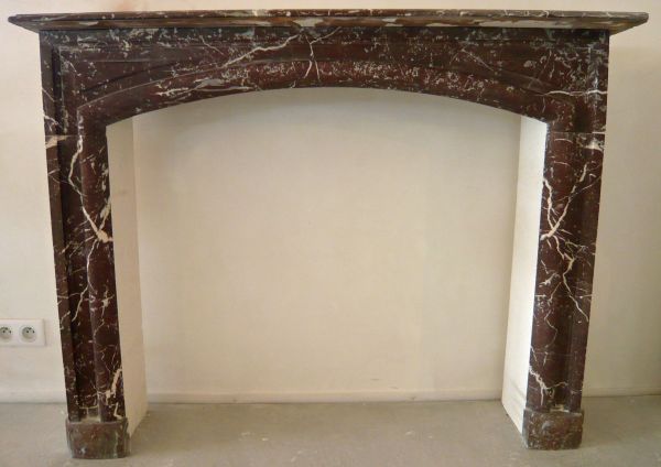 Antique red marble mantle for sale at Alain Bidal Antique Materials in provence.