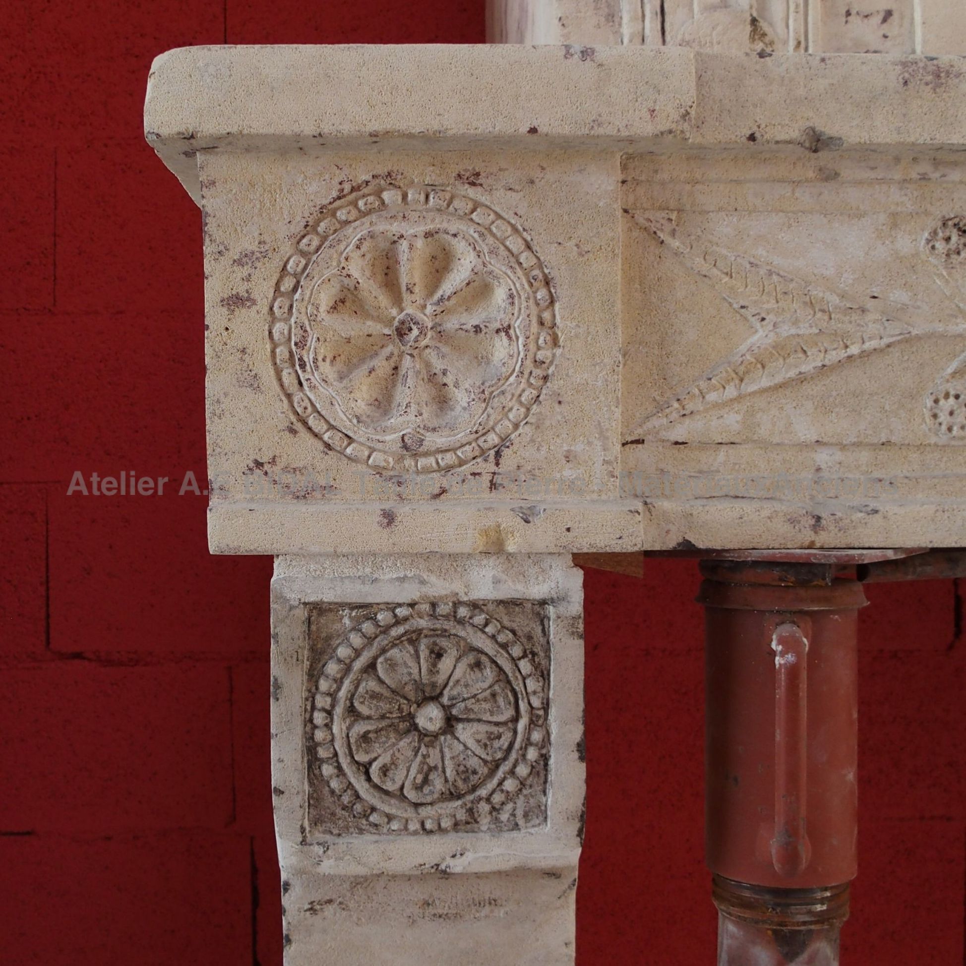 Traditional embellishments on our old Louis XVI fireplace.