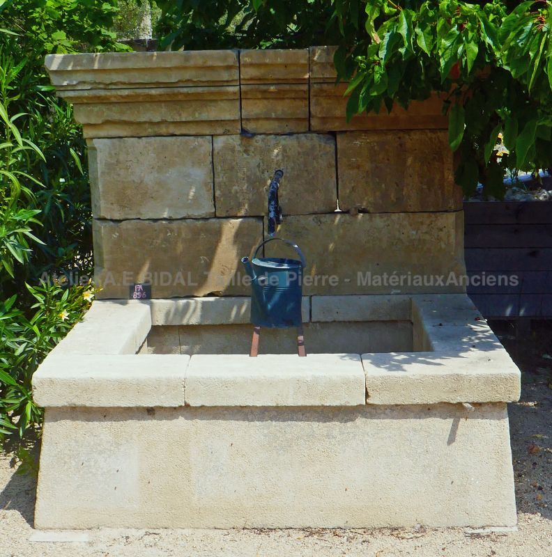 Antique stone wall fountain ideal to create a lovely water spot in a garden