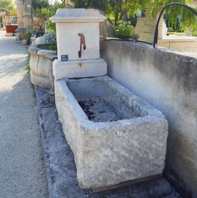 Beautiful stone fountain for a rustic-style landscaping from Provence