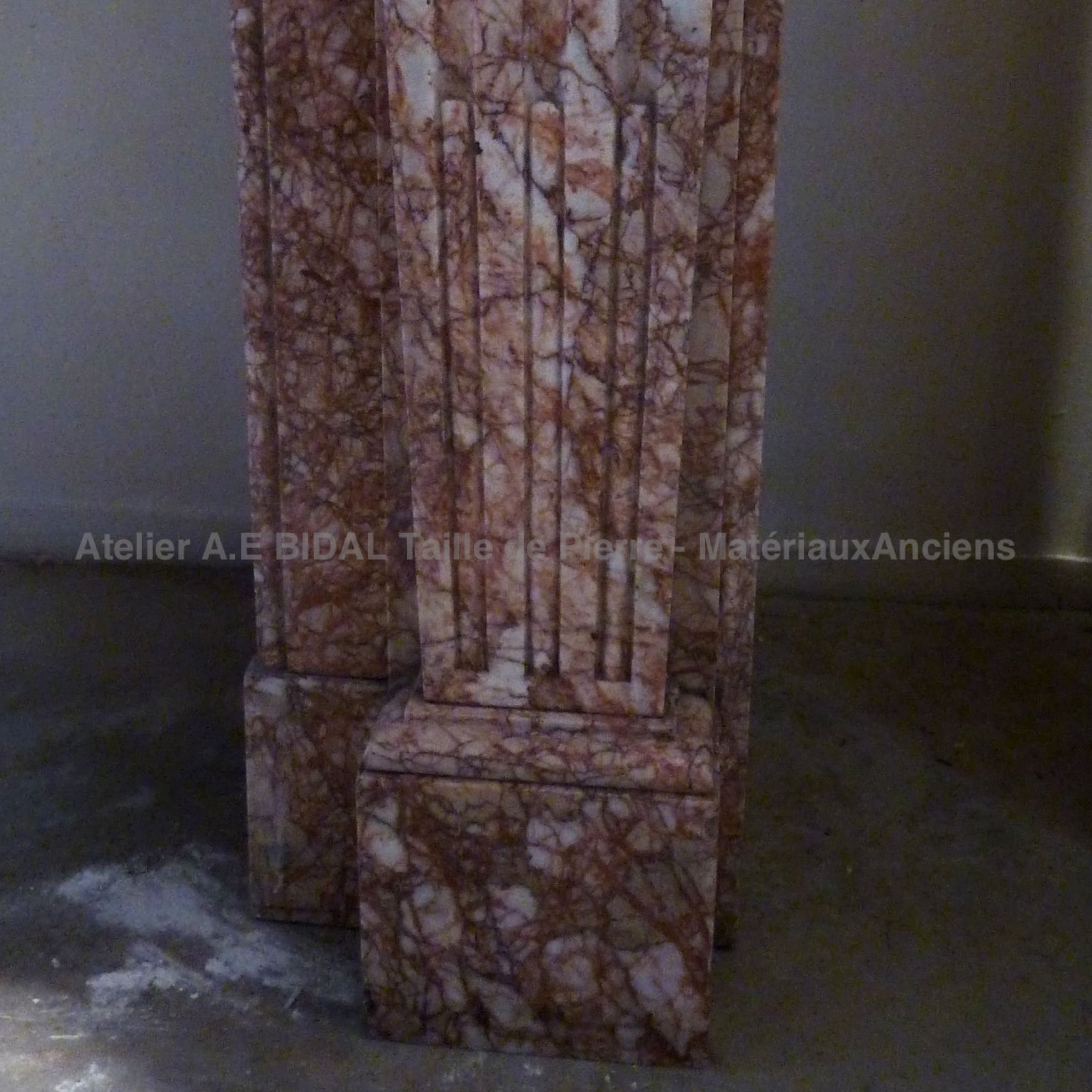 Decoration of the jamb of our pink marble fireplace with white stipes - Louis 16 fireplace.