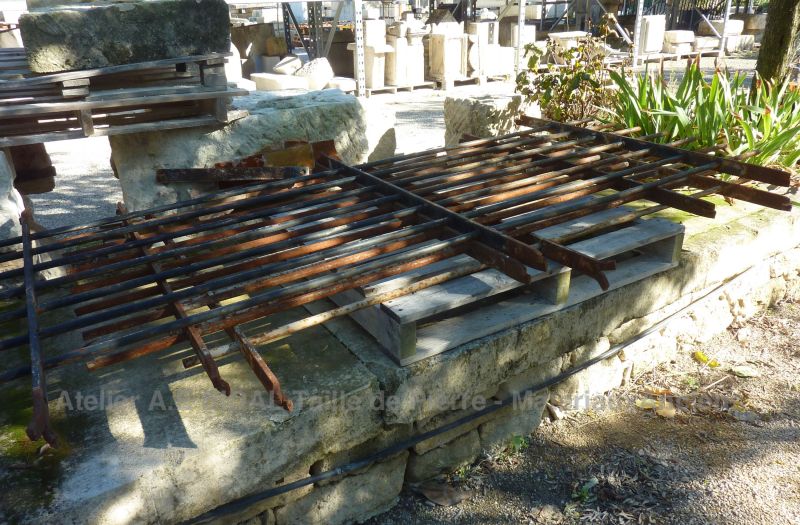 Antique wrought iron fencing gate with round bars