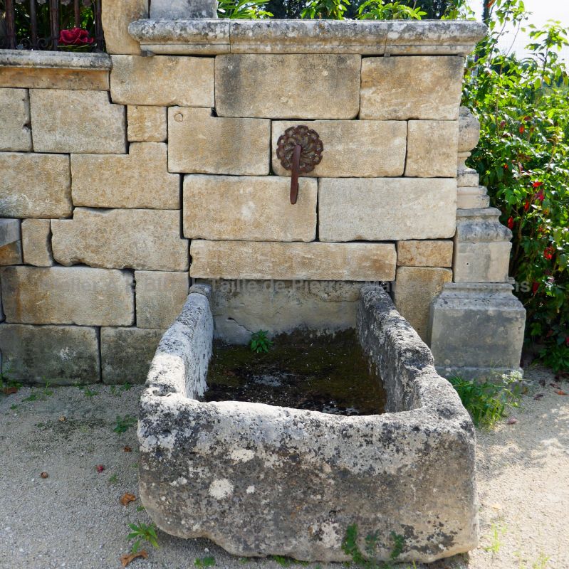 Detail of the antique stone trough on our large garden fountain in stone and metal - Alain Bidal Antique Materials in Provence