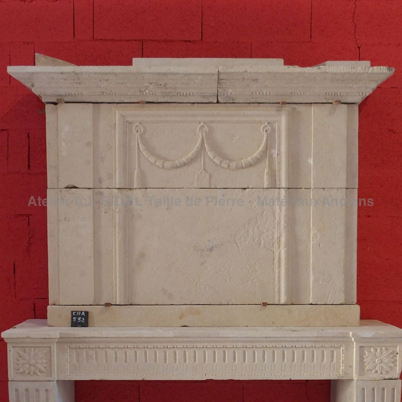 Old fireplace found in a French manor house - fireplace made of stone with a fine grain.