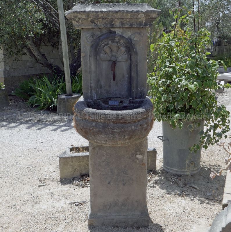 This lovely small fountain is a wall fountain that can be installed on a terrace or in a garden.