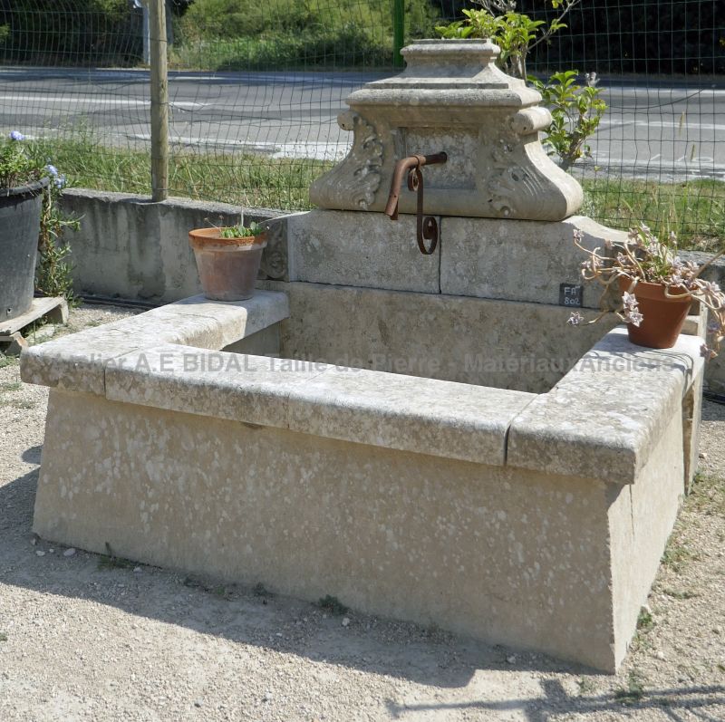 Outdoor fountain with basin - garden fountain in an old fountain style.
