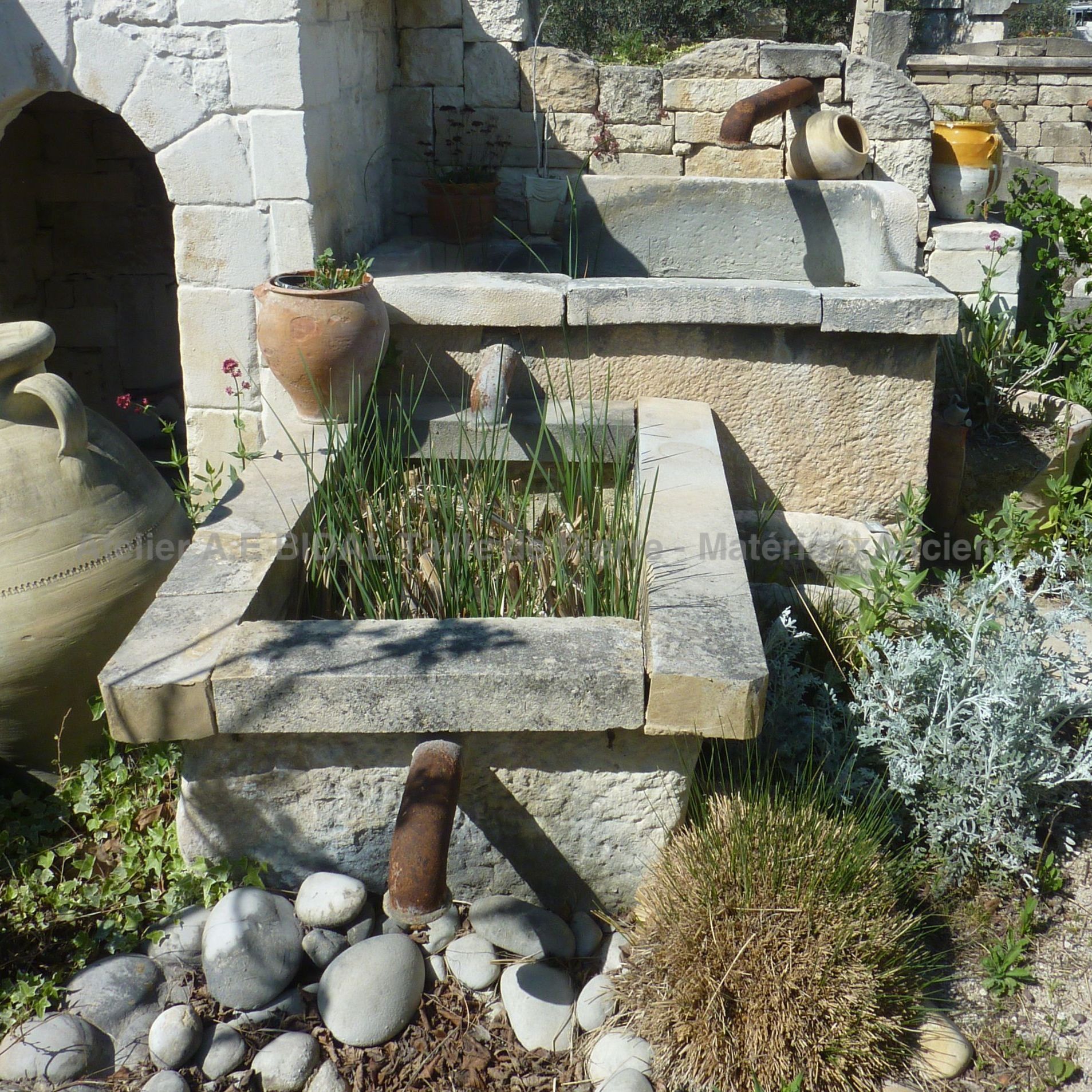 Garden fountain with dual basin.