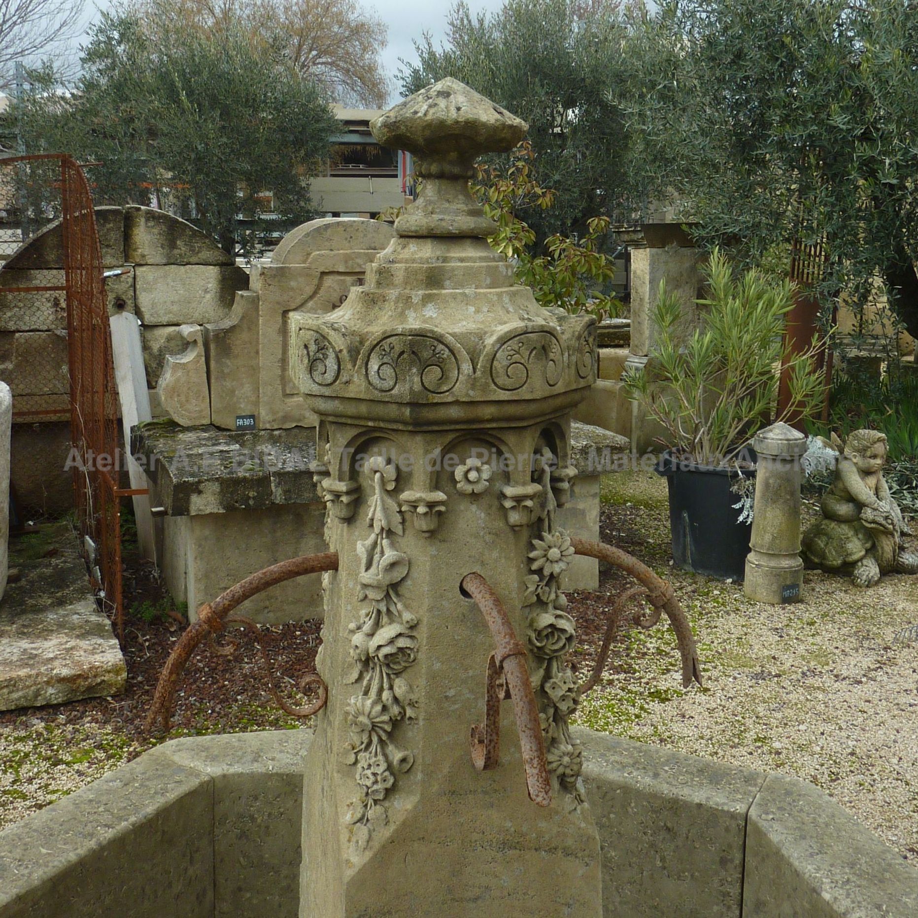 Central fountain in old stone and wrought iron | Garden fountain beautifully carved by hand.