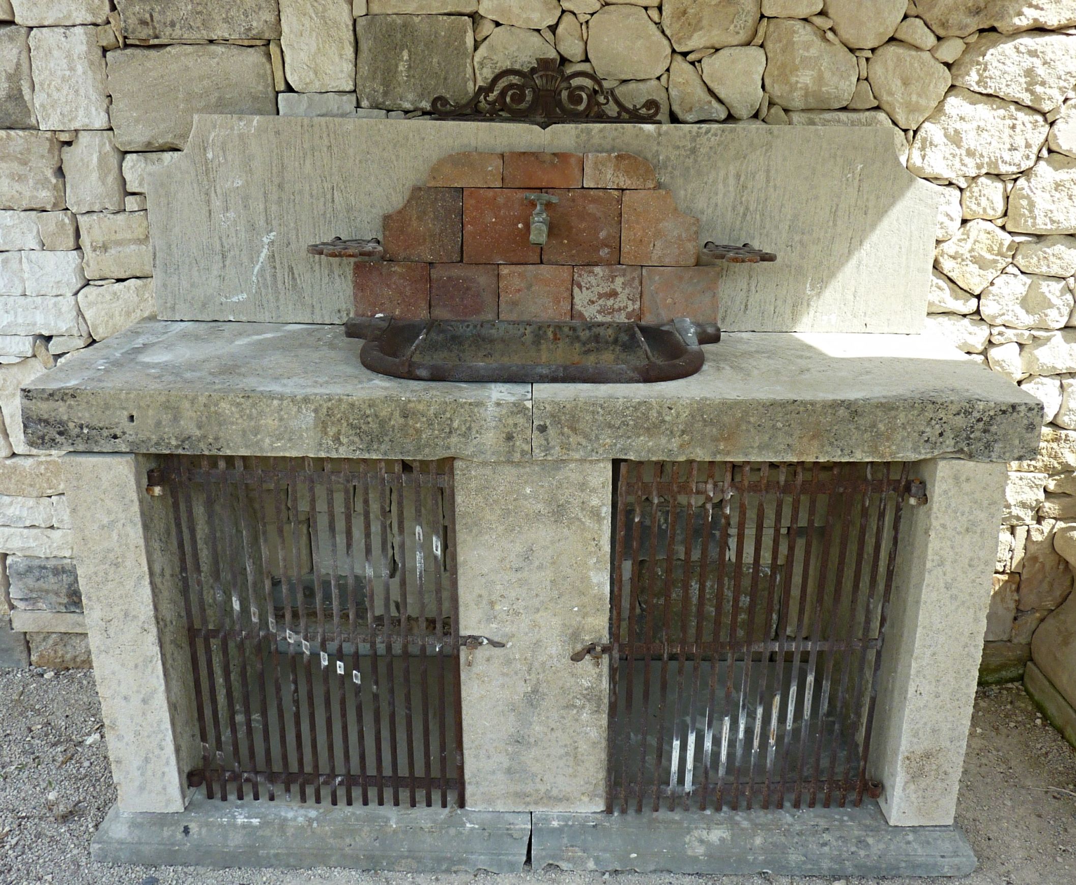 Rustic summer kitchen made of old materials - a craft made outdoor kitchen.