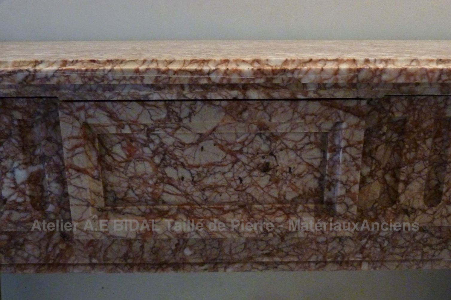 Traditional fireplace - pink marble fireplace in Louis 16 style.