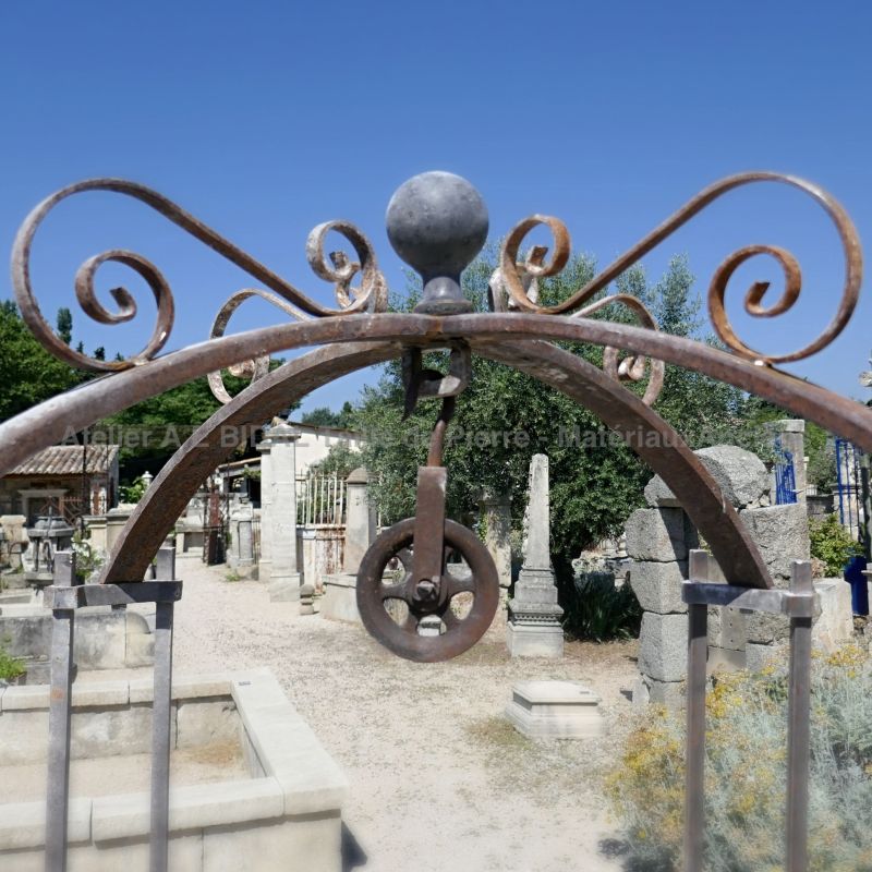 Detail of the scrap well-top on our pretty round stone and iron well | Stone well on sale at Alain BIDAL in Provence.